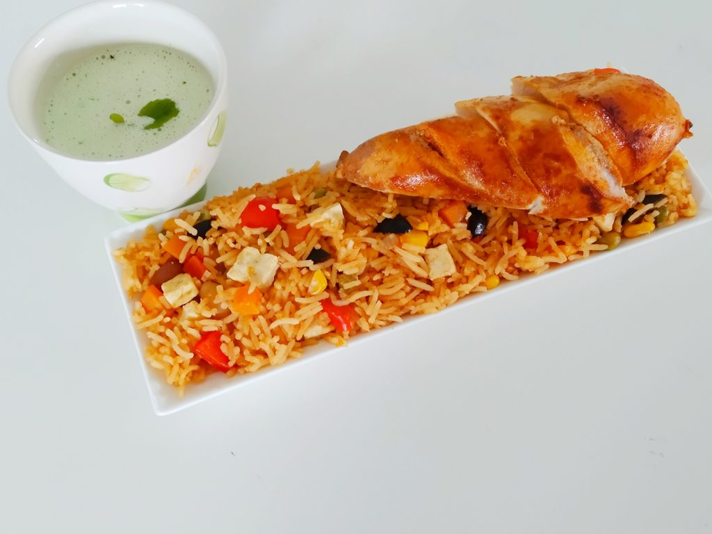 Mexican rice served with rotisserie chicken and mayo